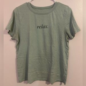 Green shirt that says “relax” on the front